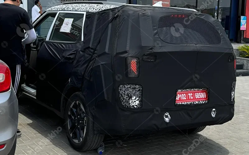 Kia carens facelift spied with ev5 inspired design